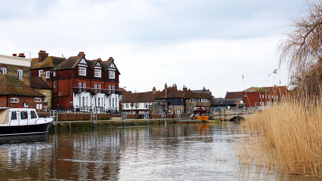 An image overlooking the River Stour in Sandwich, The Barbican in Sandwich, and the Toll Bridge.